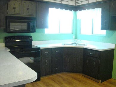 Kitchen. The corner windows not only allow sunligh
