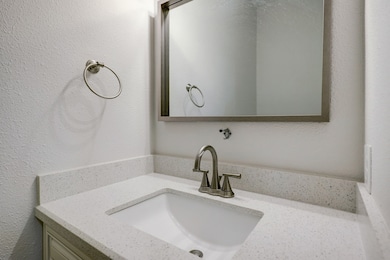 New fixtures and quartz countertops in the bathroo