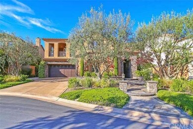 Lush landscaping and luxurious entryway.