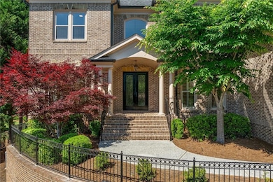 Entrance to property featuring french doors, brick