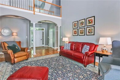 View of Living Room to Foyer with Front Door in th