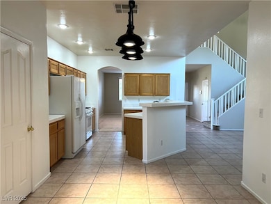 Kitchen with visible vents, light tile patterned f