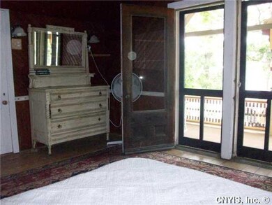 Bedroom. This bedroom features it s own porch over