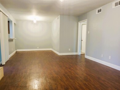 Unfurnished room featuring dark hardwood / wood-st