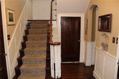 Natural wood staircase all the way to 3rd floor.