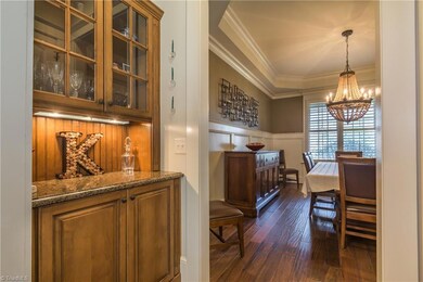 Bar area between the kitchen and dining room is a perfect spot for your extra stemware or serving pieces. There is also a huge closet for tons of extra storage!