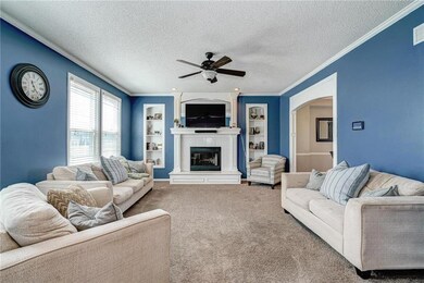 Huge living room has built-ins and fireplace!