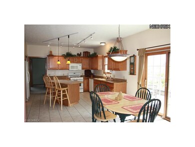 The Eat-In Kitchen has granite countertops and cer