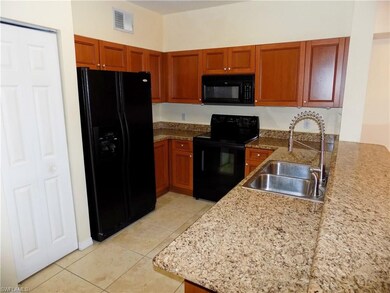 Spacious kitchen with granite countertops, cherry 