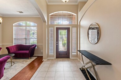 Welcoming entrance with high ceilings.