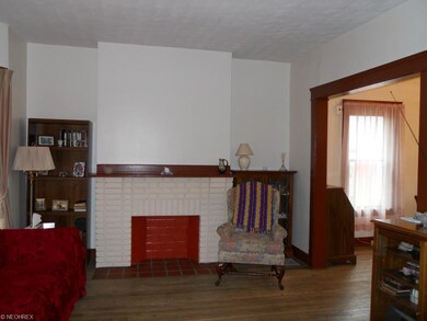 Living Room with wood floors and natural woodwork.