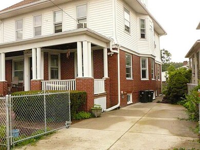 Exterior Front. Right-side townhouse has concrete
