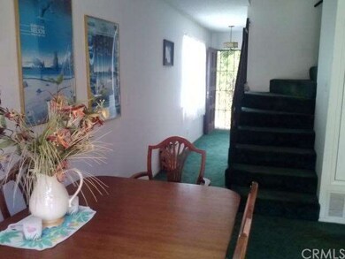 Entry way, dining area and stairs to the bedrooms