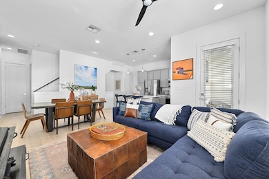 Living room with recessed lighting, light wood-ty