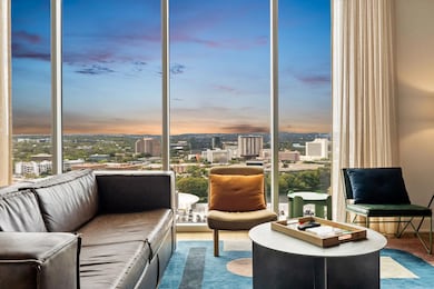 Sitting room with a view of city, plenty of natur