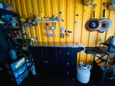 Small kitchen area inside container.