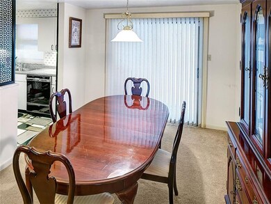 Dining room, kitchen on left and sliding glass doo