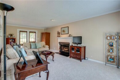 Spacious great room features include new carpet, gas fireplace, and neutral paint..