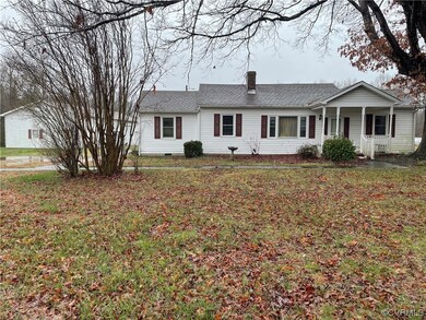 Single story home with a front yard