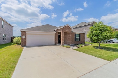 Ranch-style home featuring concrete driveway, a fr