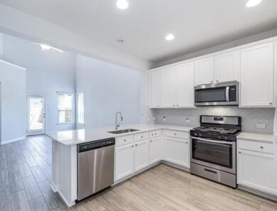 Kitchen with stainless steel appliances, a penins