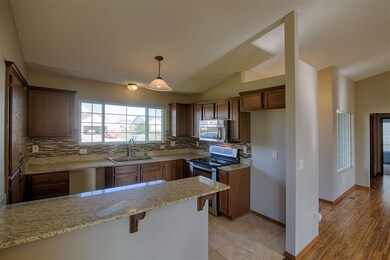 Beautifully updated kitchen with granite counter t