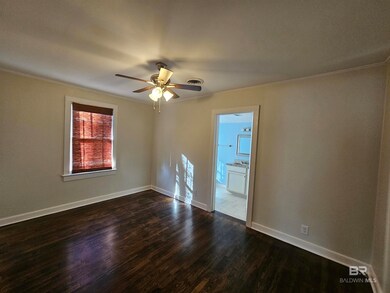 Primary Bedroom hardwood flooring, ceiling fan
