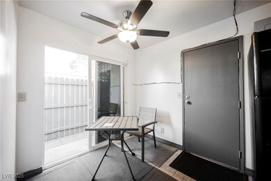 Office area with ceiling fan and baseboards