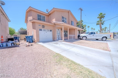 View of front of home featuring stucco siding, an
