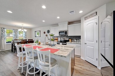 Kitchen with a breakfast bar area, appliances wit