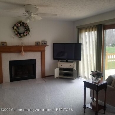 living room w fireplace and TV view to b