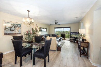 Dining area with light wood-style floors, a ceilin