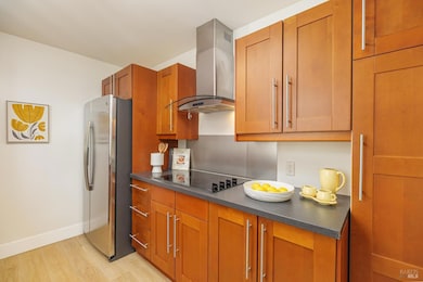The frig has an icemaker. The cabinetry is beautiful and remains like new.