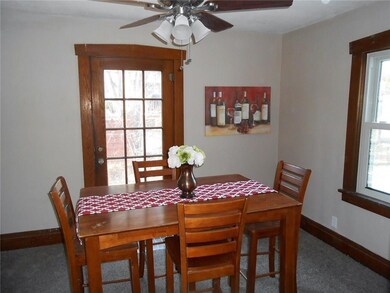 Dining room with lovely gum wood trim.