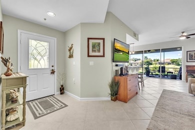 Foyer entrance featuring ceiling fan, light tile patterned flooring, and recessed lighting