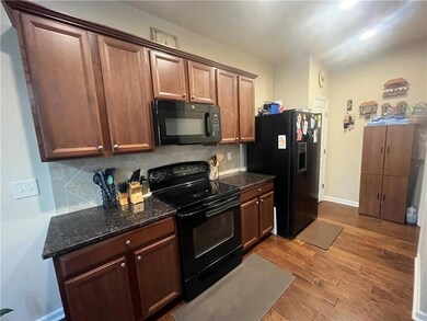 Kitchen featuring tasteful backsplash, baseboards,