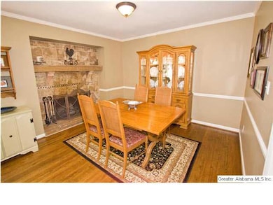 Dining room has tile wood burning fireplace!