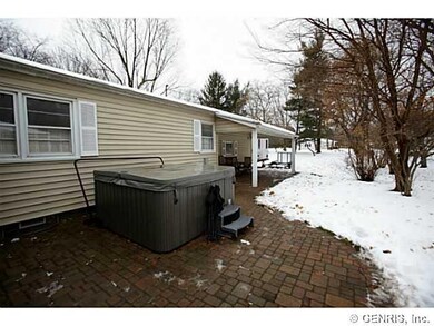 Exterior Back Patio with hot tub and covered area