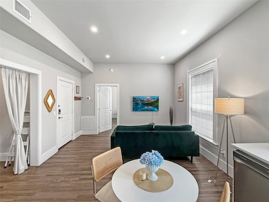 Dining room featuring dark wood-type flooring and recessed lighting
