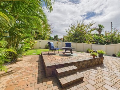 A beautifully landscaped backyard featuring a buil