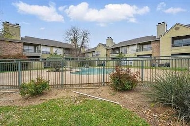 Community pool featuring a patio and a residential view