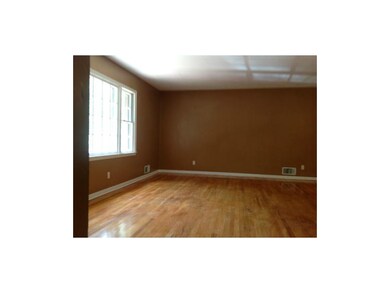 Living room features beautiful hard wood floors wh