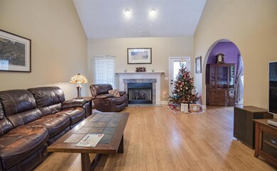 Spacious living room has wood floors, vaulted ceiling and neutral colors! 2831 Apache Moon Terrace, Murfreesboro, TN 37127