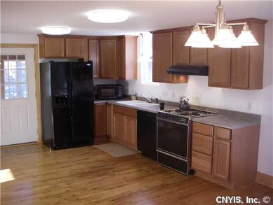 Kitchen. Spacious kitchen with hardwood floors & a