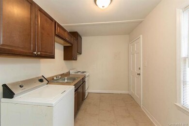 Kitchen with new cabinets, countertop, flooring an