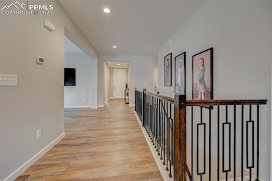Corridor featuring recessed lighting, baseboards, 