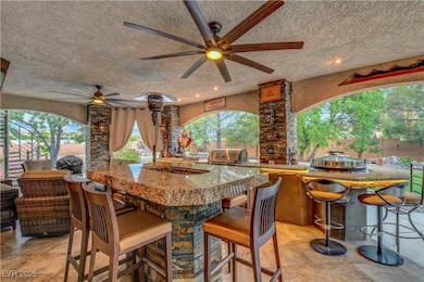 Oversized covered patio with outdoor kitchen