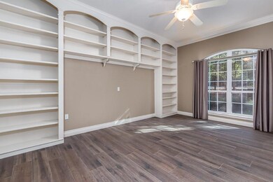 Huge formal study with custom built ins and extra storage closet