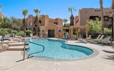 Community pool featuring a patio area