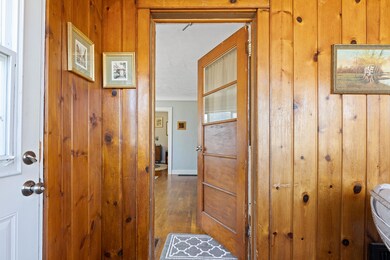 Front entry from enclosed porch.
